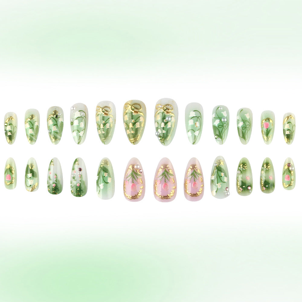 Botanical Elegance Press on Nail Set in Long Almond Shape with Soft Green and Floral Design Featuring Golden Accents