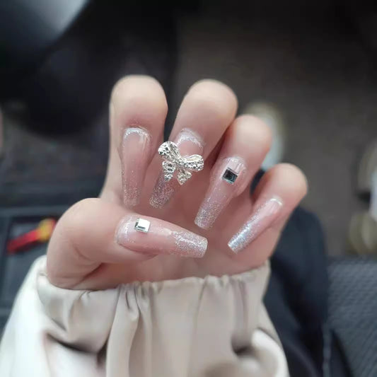 Glamorous Sparkle Long Coffin Pink Press On Nail Set with Rhinestone Bow and Geometric Accent Decor