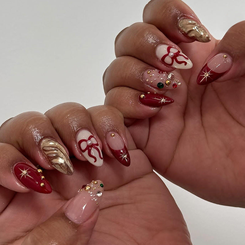 Holiday Glamour Long Almond Red and Gold Press On Nail Set with Festive Bow Design and Sparkling Accents
