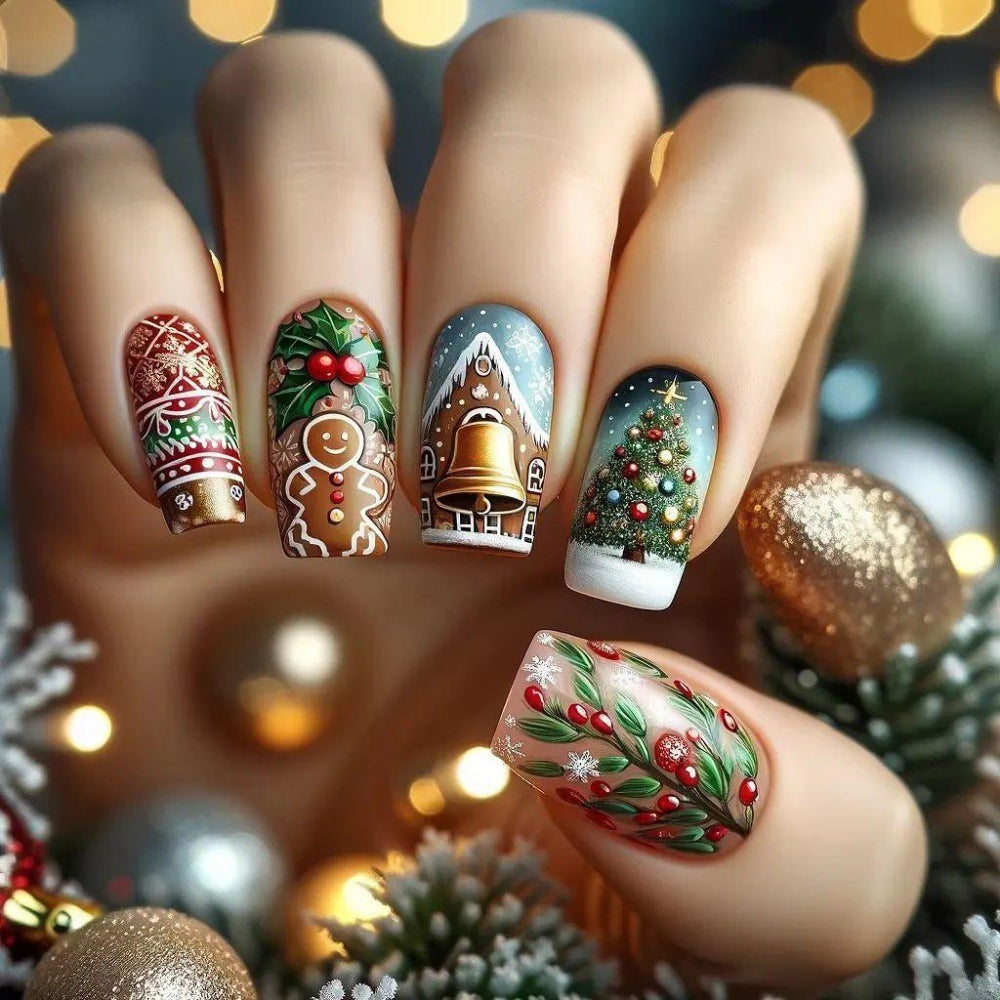 A set of press-on nails featuring a variety of holiday designs including Christmas trees, snowflakes, and festive houses in red and brown colors.