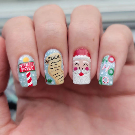 Festive Winter Wonderland Square Medium Light Blue Press-On Nail Set with Charming Santa and North Pole Designs