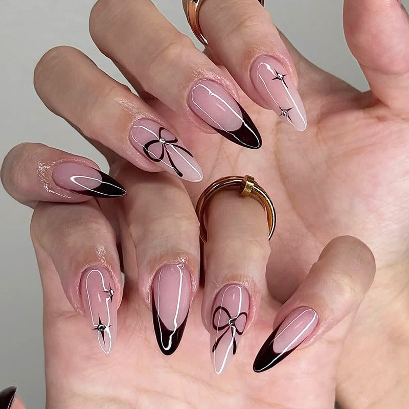 Chic Elegance Long Almond Pink and Black Ombre Nails with Bow Design