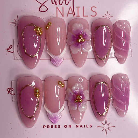 Blooming Elegance Long Almond Pink Colored Press on Nail Set with Floral Accents and Gold Detailing