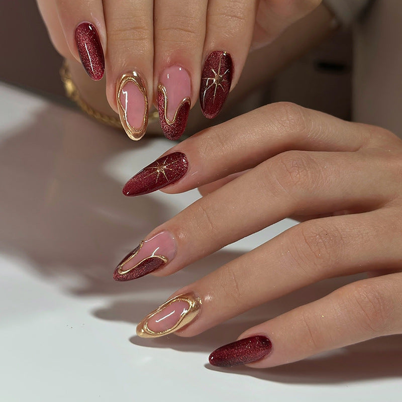 Celestial Glamour Long Almond Burgundy Glitter Nails with Gold Accent Design