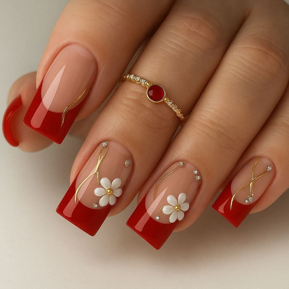 Charming Floral Elegance Long Square Red Nails with Gold Accents and Dainty Flower Designs