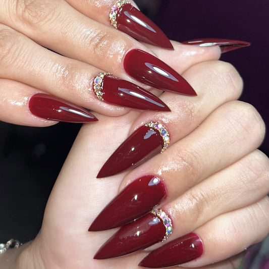 Glamorous Crimson Long Stiletto Nail Set with Dazzling Gem Accents