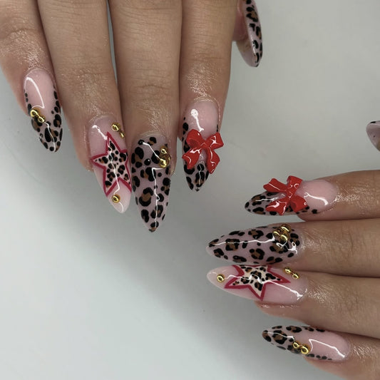 Wild Elegance Long Stiletto Leopard Print Press on Nails with Bold Red Bows and Star Accents