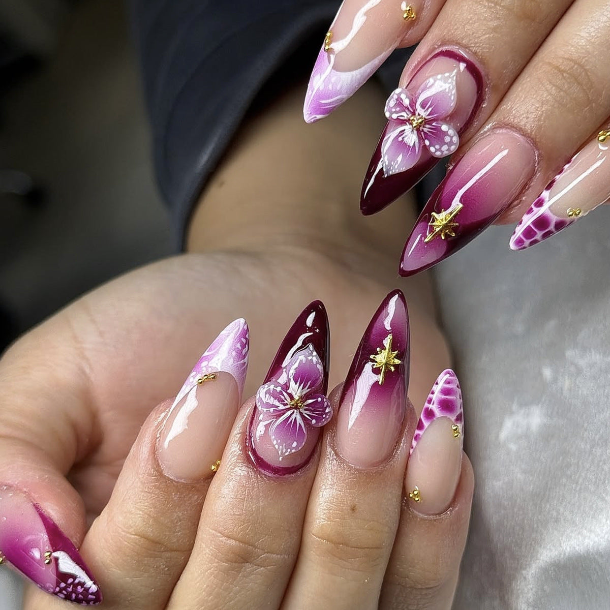 Elegant Blossom Artistry Long Stiletto Burgundy and Pink Gradient with Floral Accents and Gold Details Press-On Nail Set