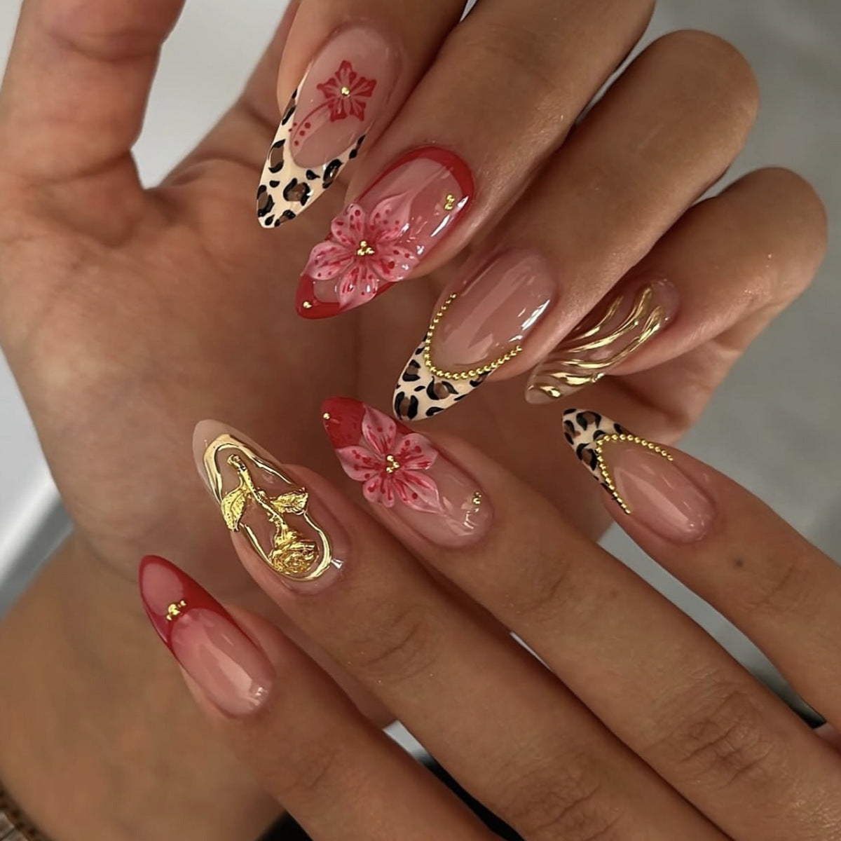 Floral Jungle Inspired Long Almond Shaped Pink and Leopard Print Press On Nail Set with Gold Accents and Flower Designs