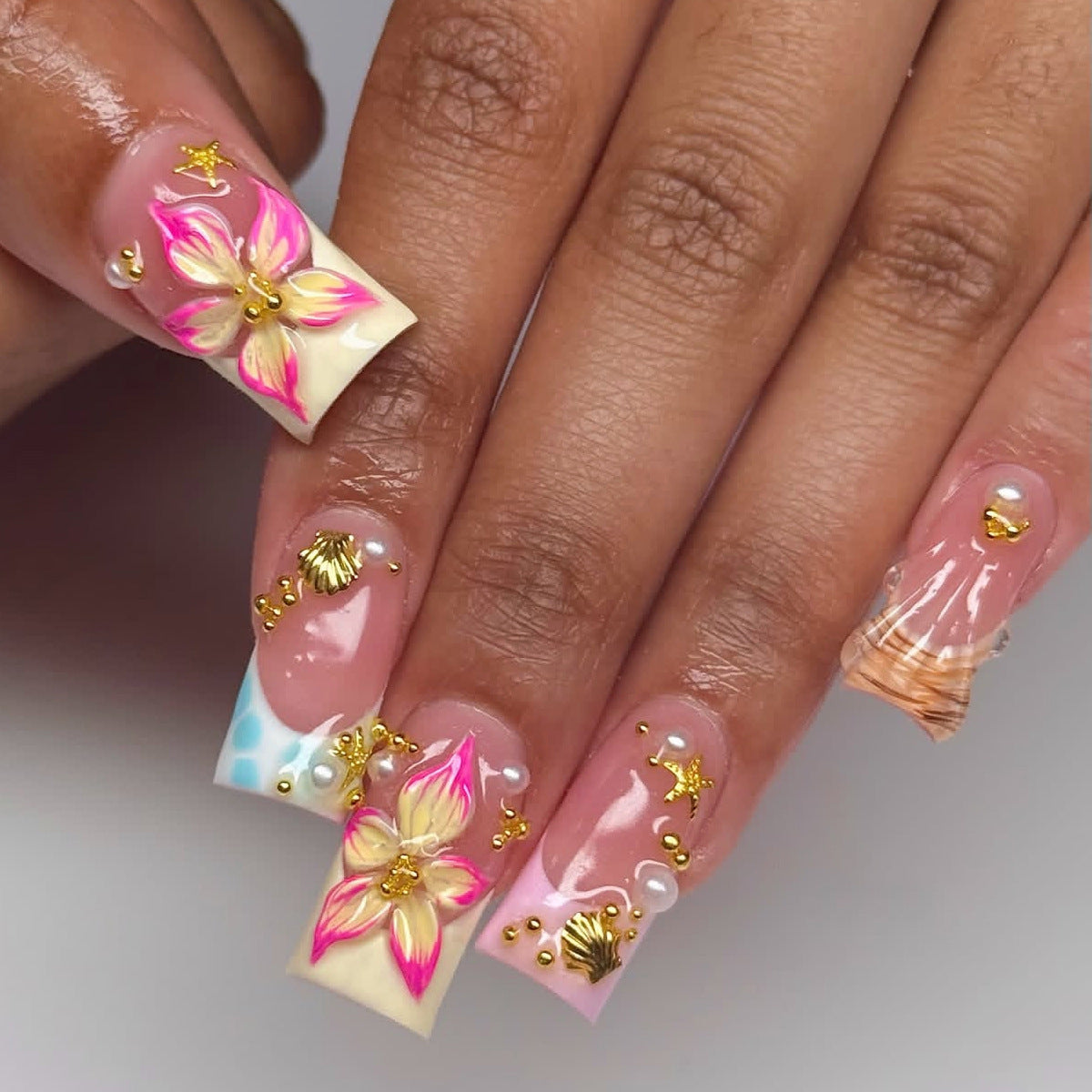 Tropical Elegance Medium Square Pink Floral Nail Set with Decorative Gold Accents
