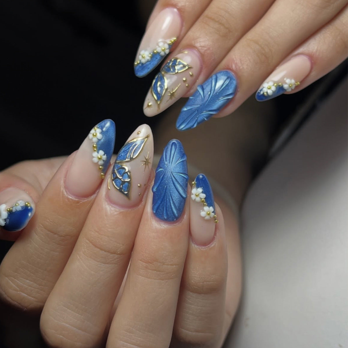 Ocean Breeze Medium Almond Blue Nail Set with Floral Designs and Elegant Textures