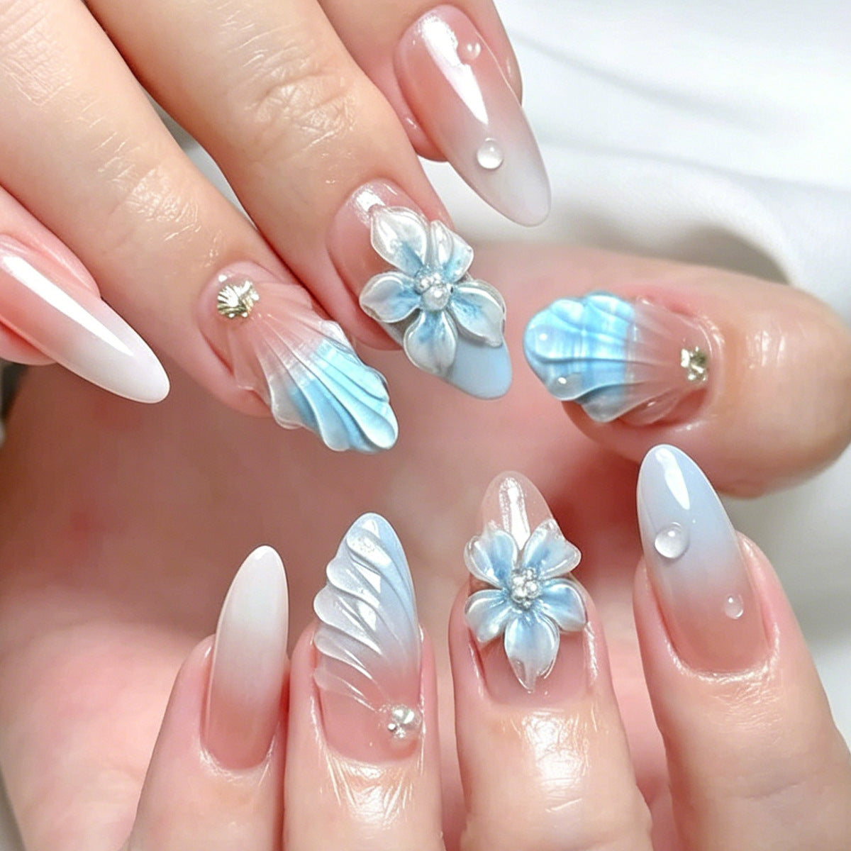 Ocean Breeze Long Almond Blue Press on Nail Set with Floral Accents and Wave Design