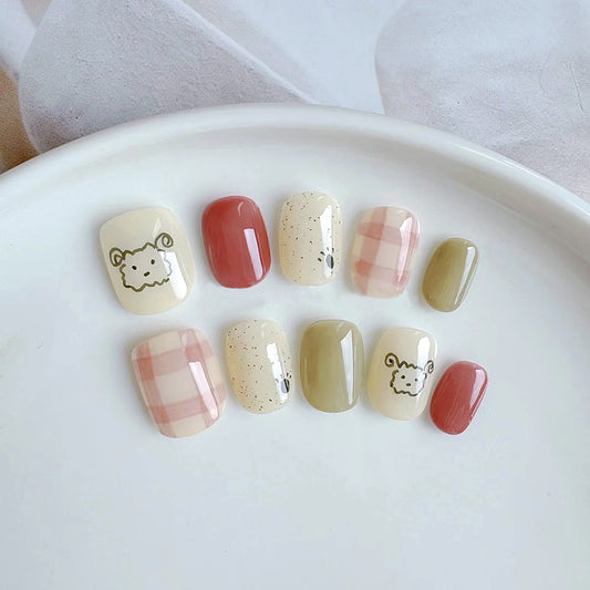 Whimsical Meadow Short Squoval Press On Nail Set in Pastel Yellow Green and Earthy Red with Adorable Animal Illustrations