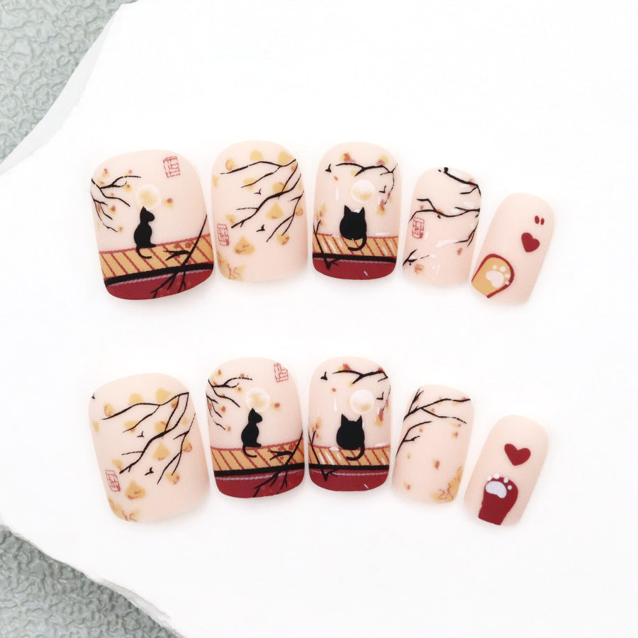 Whimsical Autumn Charm Short Squoval Peach Nail Set with Cat Designs and Leaf Accents