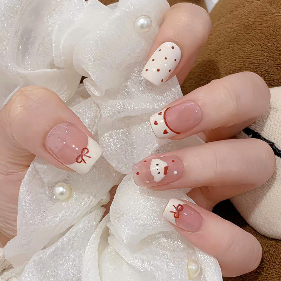 Charming Winter Wonderland Medium Square Pink and White Nail Set with Adorable Holiday Bow and Heart Designs