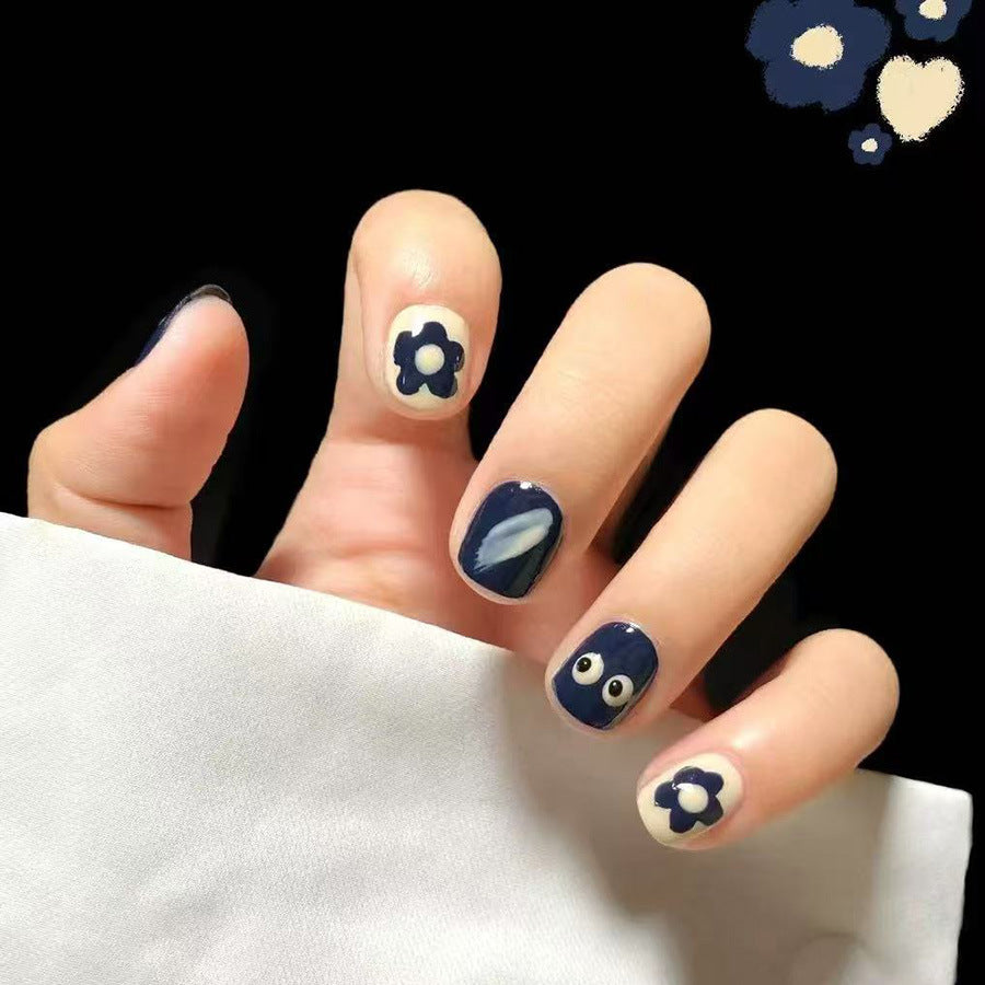 Whimsical Floral Vibe Short Round Navy Blue Nail Set with Unique Flower Design