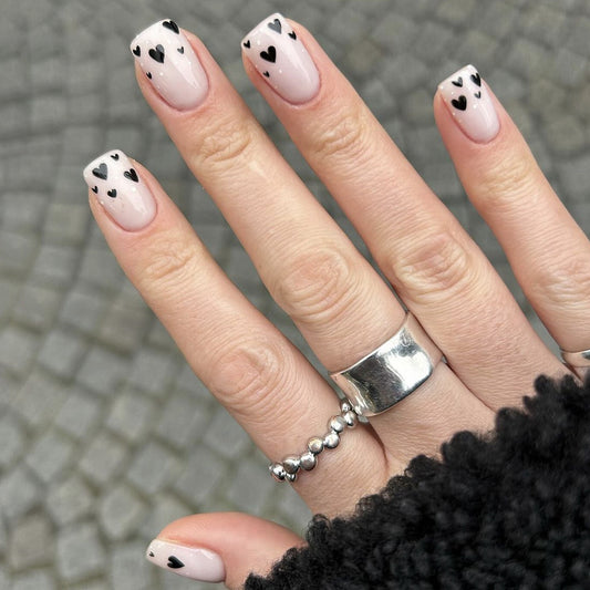 Heartfelt Elegance Short Square Beige Nails with Charming Black Heart Accents