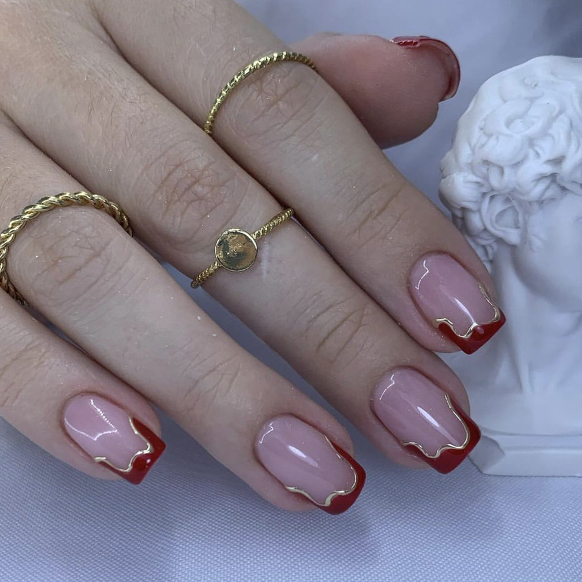 Elegant Elegance Medium Square Glossy Pink Nails with Red Tips and Gold Detailing