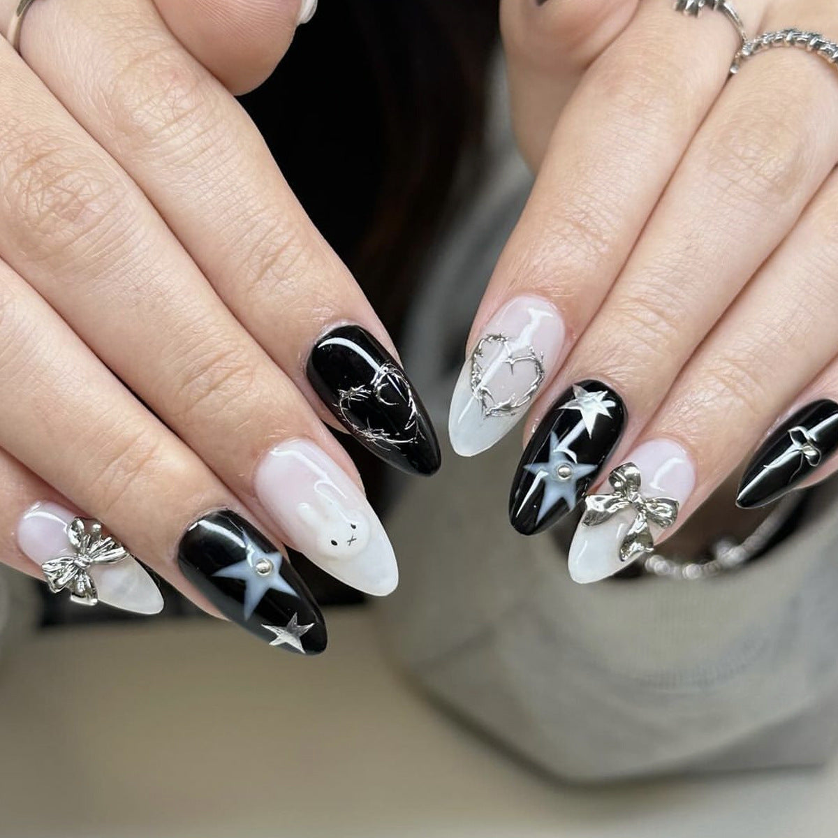 Mystical Elegance Medium Almond Black and White Press On Nail Set with Unique Charms and Designs