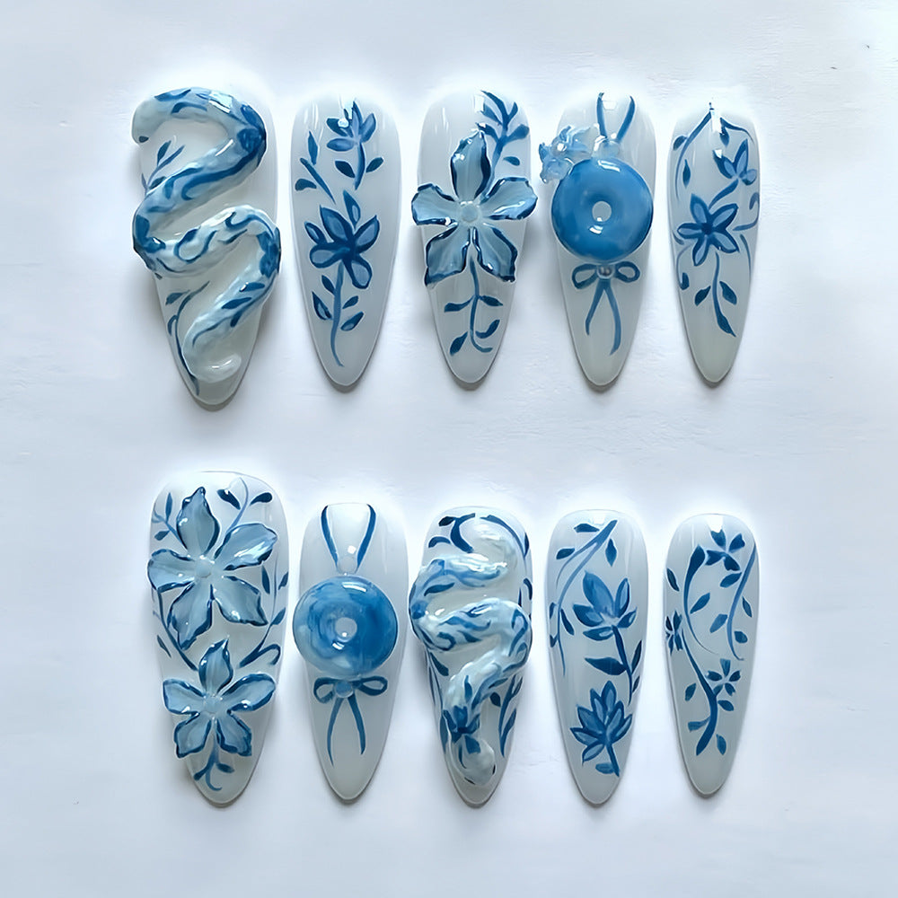 Whimsical Blue Flower Medium Almond Press On Nail Set with Unique Artistic Designs