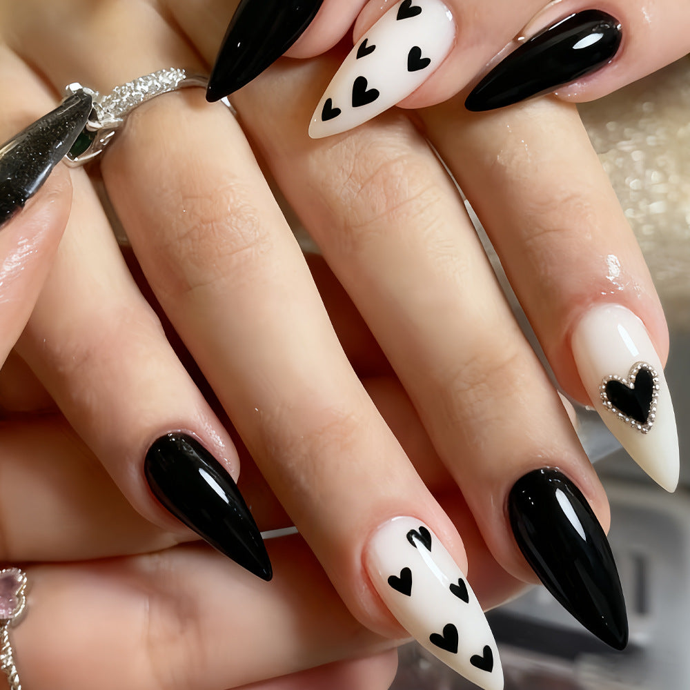Charming Romance Long Almond Black and White Press on Nail Set with Heart Patterns and Rhinestone Accent