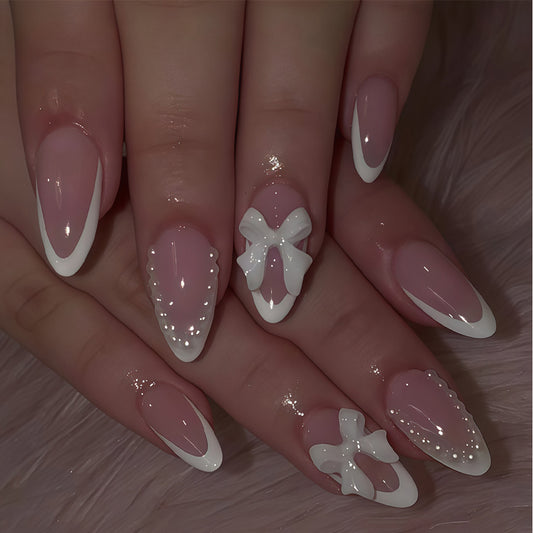 Whimsical Elegance Medium Almond Pink Press On Nail Set with Stylish White Tips and Chic Bow Embellishments