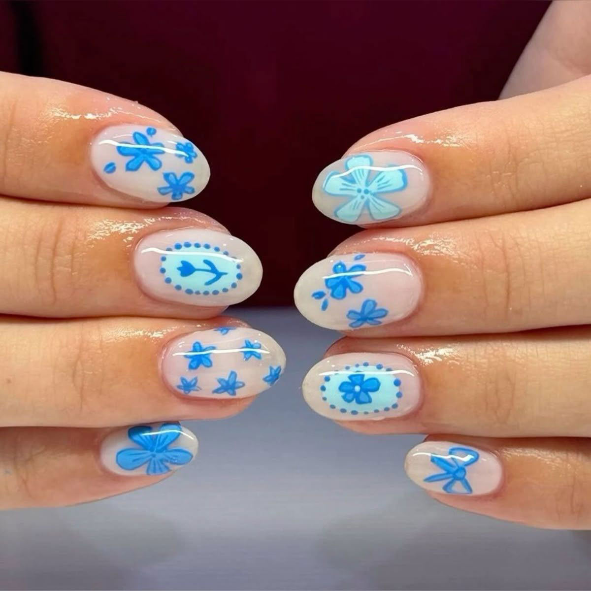 Blossoming Serenity Short Oval Blue Floral Press on Nail Set with Intricate Design