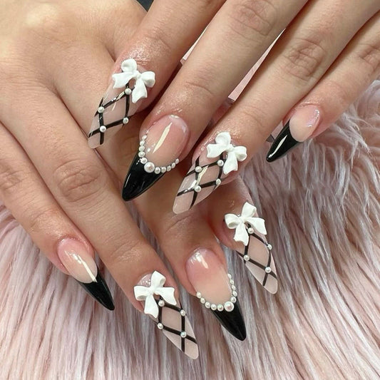 Chic Elegance Long Almond Jet Black and Clear Press on Nail Set with Artistic Bow and Pearl Accents