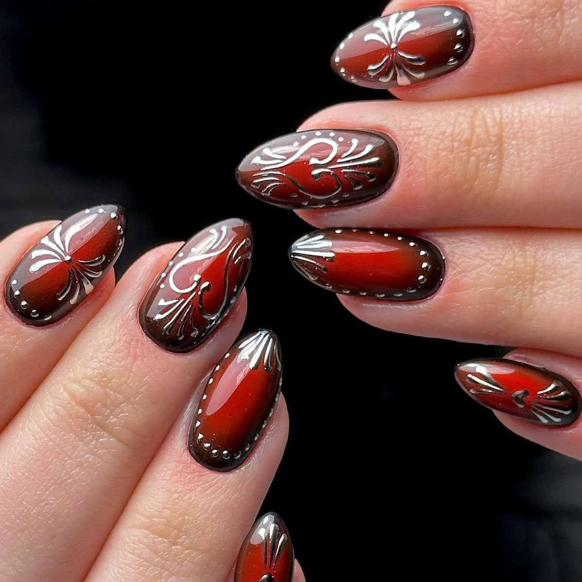 Elegant Autumn Glimmer Press On Nail Set in Medium Length Oval Shape Deep Red Color with Intricate Silver Floral Design