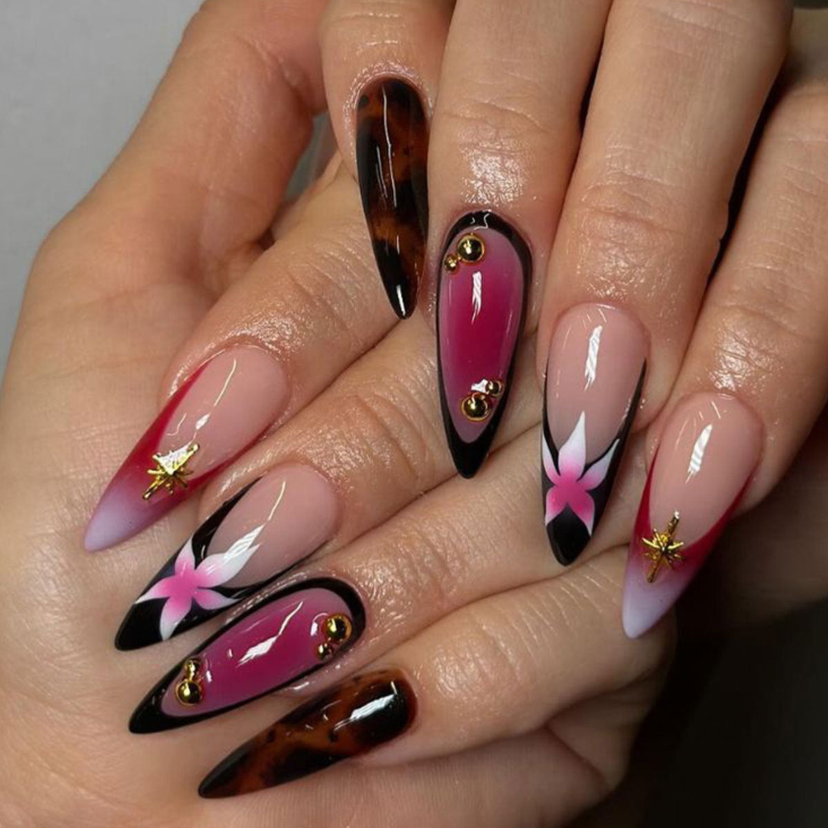 Tropical Glamour Long Almond Gradient Pink and Black Press on Nail Set with Floral Accents and Gold Embellishments