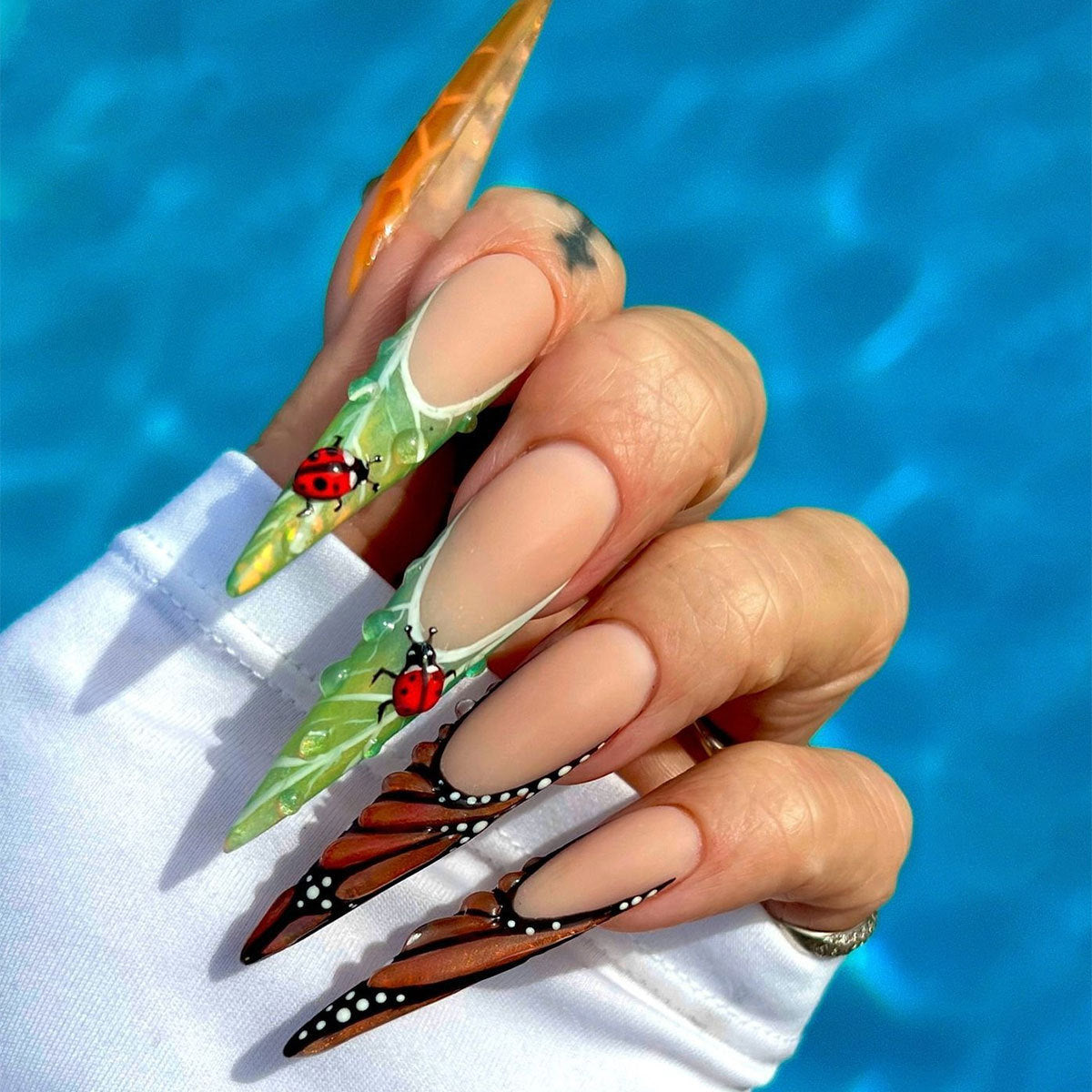 Enchanting Nature Inspired Long Stiletto Green and Brown Press On Nail Set with Intricate Ladybug and Butterfly Designs