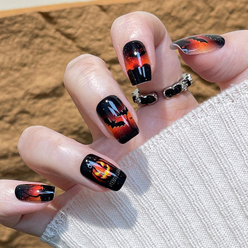 Enchanting Autumn Vibes Medium Square Black with Fiery Orange Gradient and Spooky Pumpkin Design Press-On Nail Set