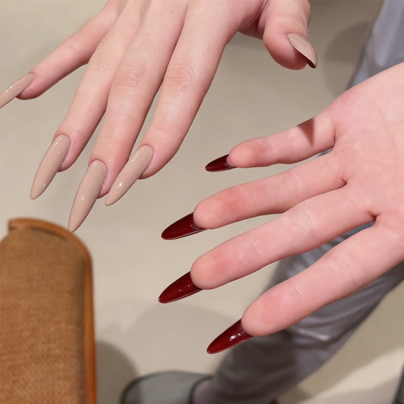 Gothic Elegance Long Stiletto Shaped Glossy Beige and Deep Red Press On Nail Set with Unique Two-Tone Design