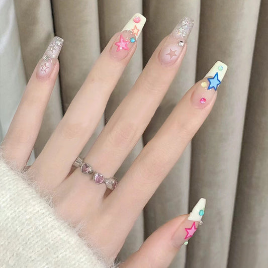 Celestial Dream Long Coffin Creamy White Nail Set with Colorful Star Accents and Glittering Gems