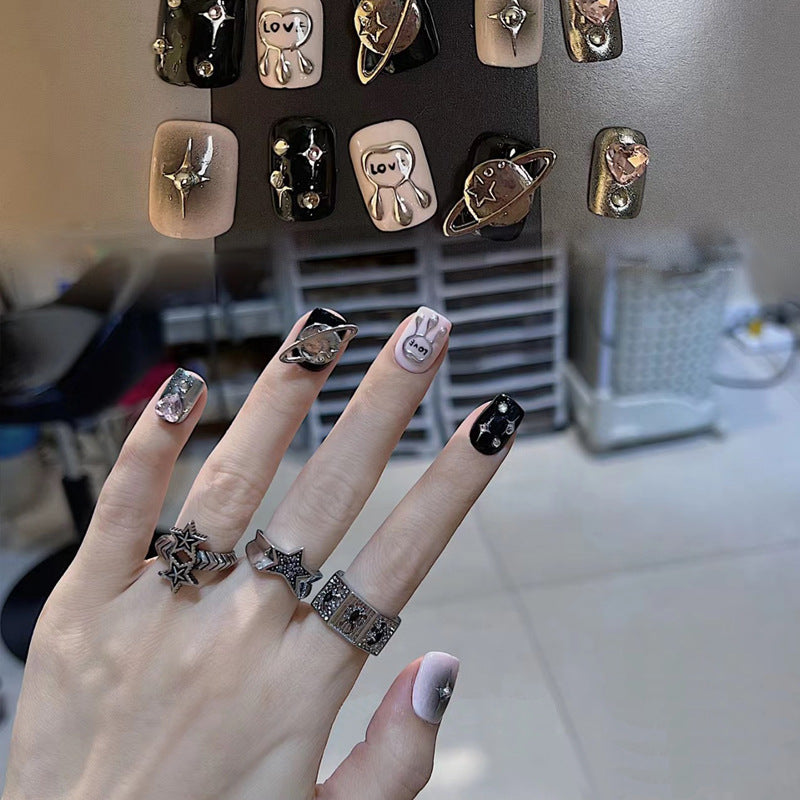 Galaxy Inspired Short Square Shaped Black and Pink Press On Nail Set with Unique Planet and Star Accents