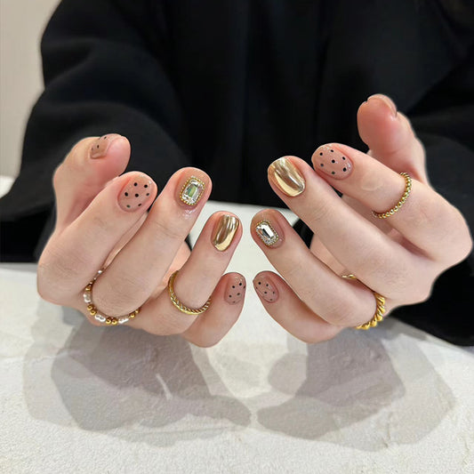 Glamorous Golden Short Squoval Nail Set with Sparkling Accents and Chic Polka Dot Design