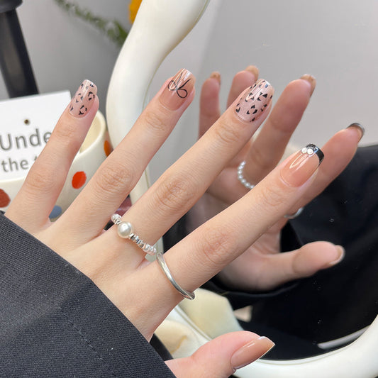 Chic Safari Inspired Medium Square Beige Nails with Elegant Design Elements and Sparkling Accents