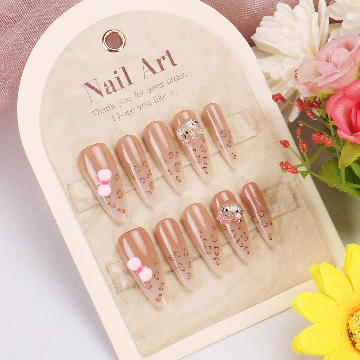 Charming Elegance Long Almond Beige Gradient Nails With Adorable Pink Accents And Shimmering Details