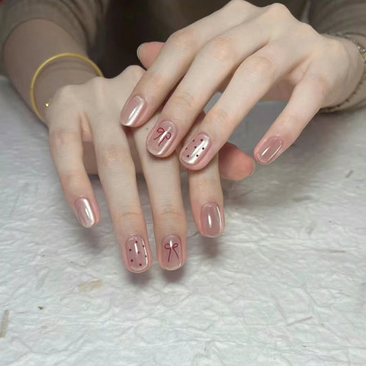 Chic Elegance Short Squoval Pink Press on Nail Set with Charming Bow and Dots Design