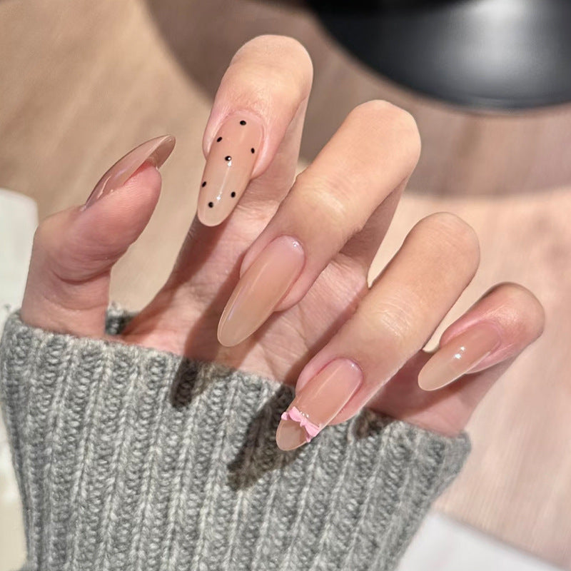 Whimsical Elegance Long Almond Beige Press-On Nail Set with Dazzling Black Dots and Charming Pink Bow