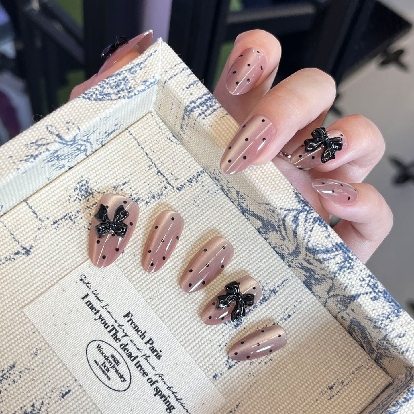 Elegant Parisian Charm Medium Almond Beige with Black Dots and Bow Accents Press-On Nail Set