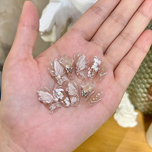 Whimsical Floral Dream Press-On Nail Set in Medium Almond Transparent with Delicate Butterfly and Pearl Accents