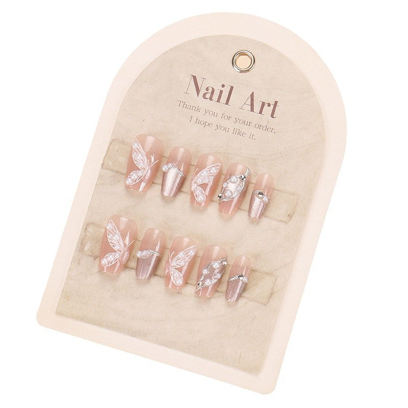 Set of decorative nails on a beige display card with 'Nail Art' text.
