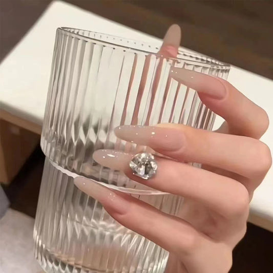 Elegant Charm Long Almond Shaped Light Pink Press On Nail Set with Sparkling Gemstone Accent