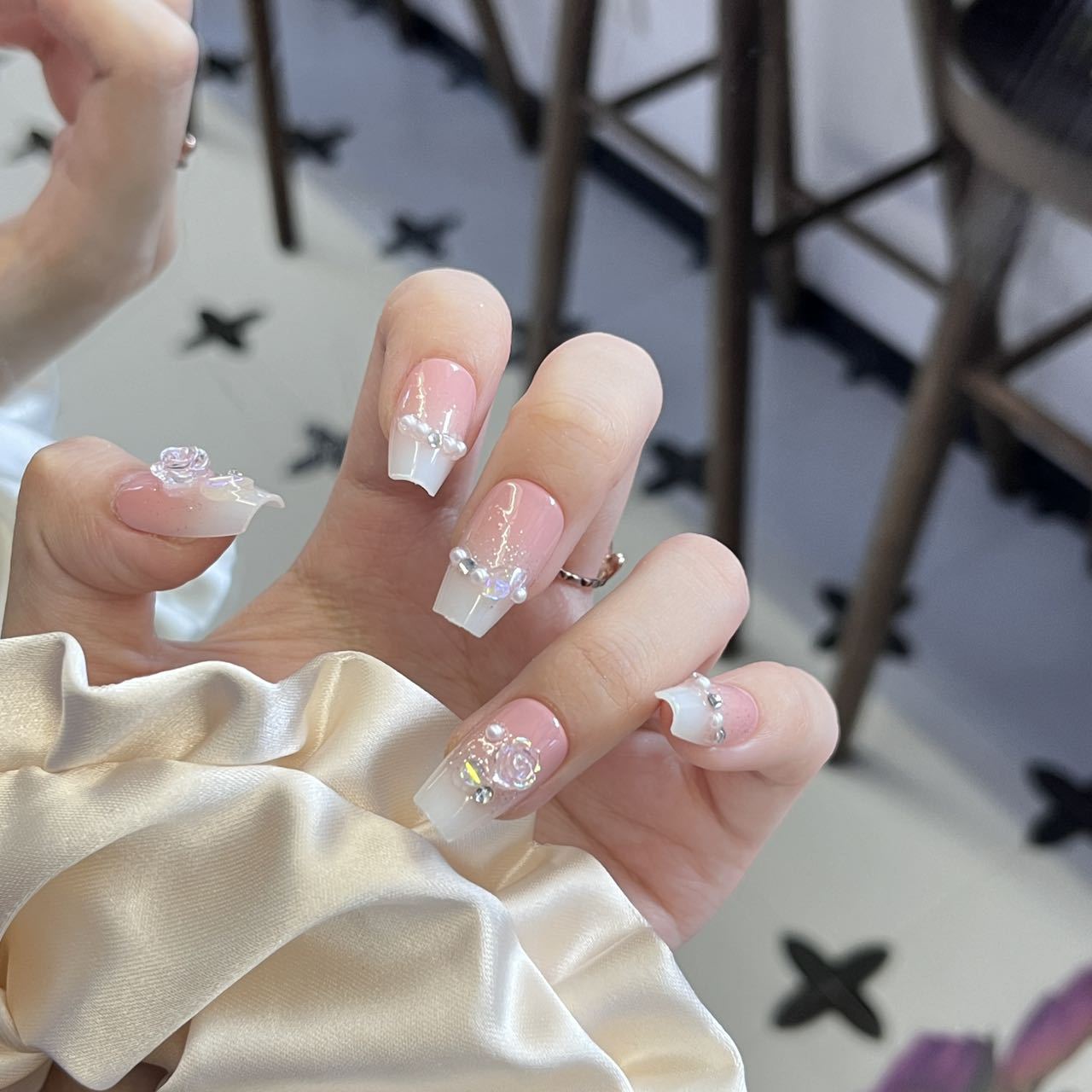 Whimsical Floral Glamour Long Square Pink and White Nails with Sparkling Embellishments
