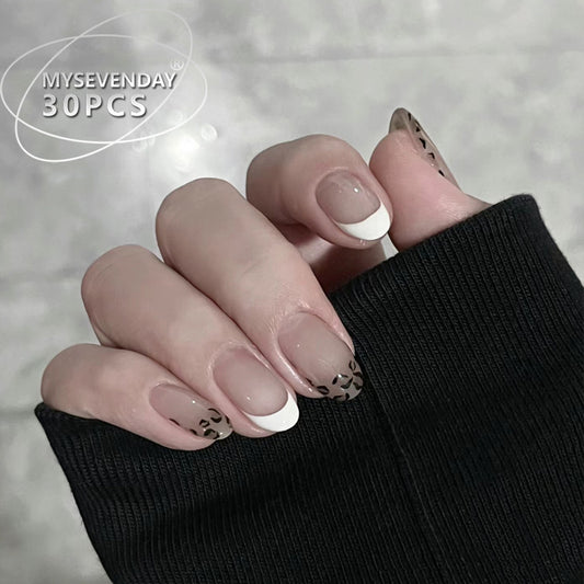 Elegant Safari Inspired Short Length Oval Shaped Translucent Beige Color with Chic Black Animal Print Design Press On Nail Set
