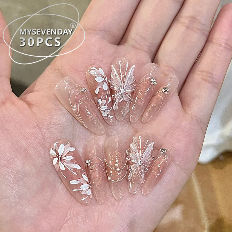Transparent nail art stickers with floral designs held in a hand, branded 'MYSEVENDAY'.