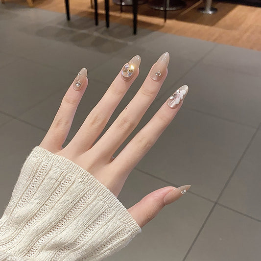 Glamorous Dreamy Long Almond Shaped Transparent Nails with Sparkling Gem Accents