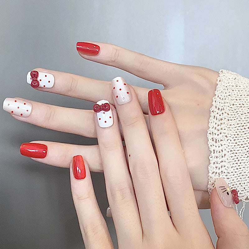 Kawaii Delight Short Square Red and White Nails with Charming Bow Accents