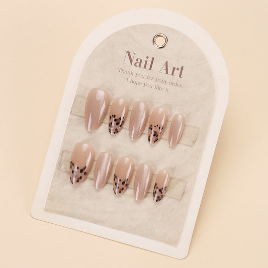 Chic Elegance Medium Almond Glossy Beige Nails with Dazzling Black Dots